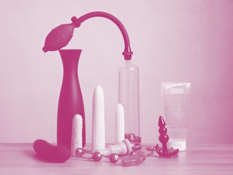 penis pump next to various sex toys 