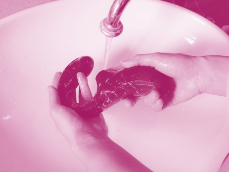 air pulse erotic adult toy being cleaning in sink under water