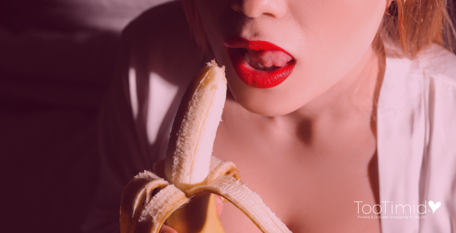 Sexy red lips with open mouth eating banana