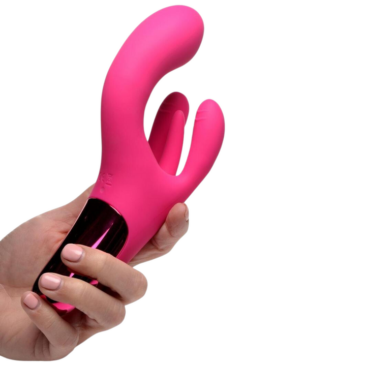 A hand holding the pink BANG! Triple Rabbit Silicone Vibrator.