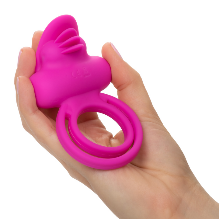 hand holding Silicone Rechargeable Dual Clit Flicker Vibrating Cockring Multispeed Waterproof Pink
