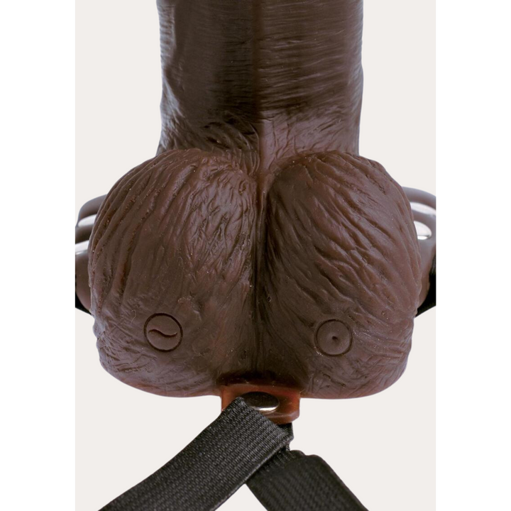 close up view of charging port and power button featured in Fetish Fantasy Series Rechargeable Hollow Strap-on Dildo with Balls and Harness with Remote Control 8in - Chocolate
