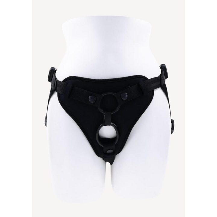 white mannequin wearing black harness 