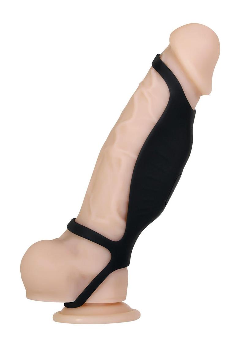 Black vibrating penis sleeve as seen worn on a nude dildo 