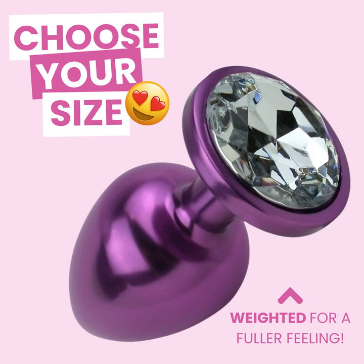 choose your size, weighted for a fuller feeling. purple anal plug with clear jewel