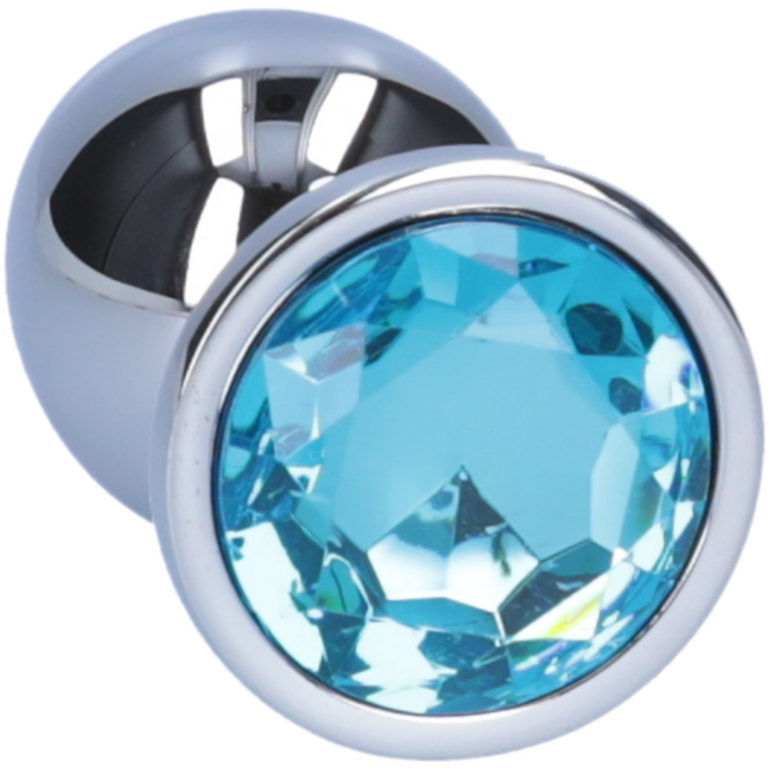 Close-up image of the light blue jewel on the anal plug.