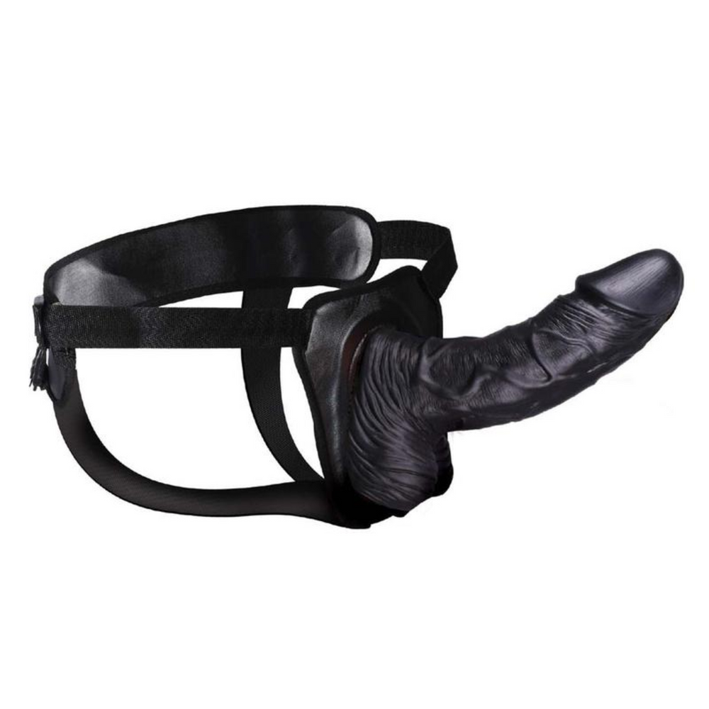 side view of black veined hollow dildo in harness