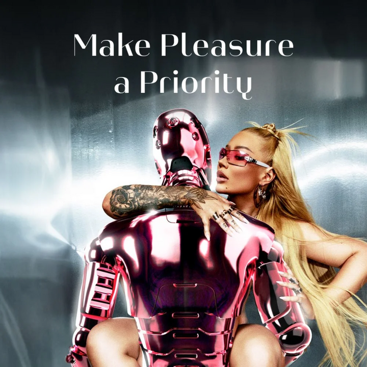 Iggy Azalea straddling a metallic pink robot 