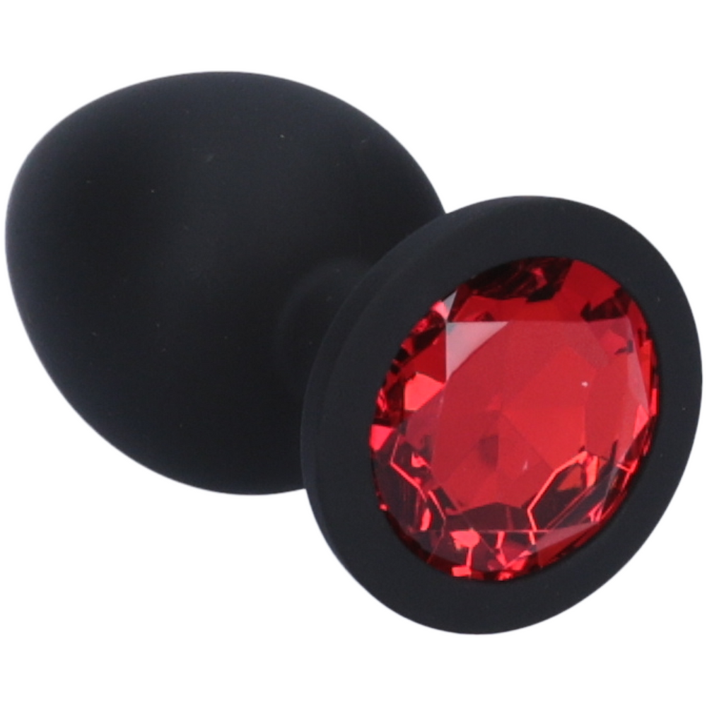 close up of red jewel in black silicone anal plug