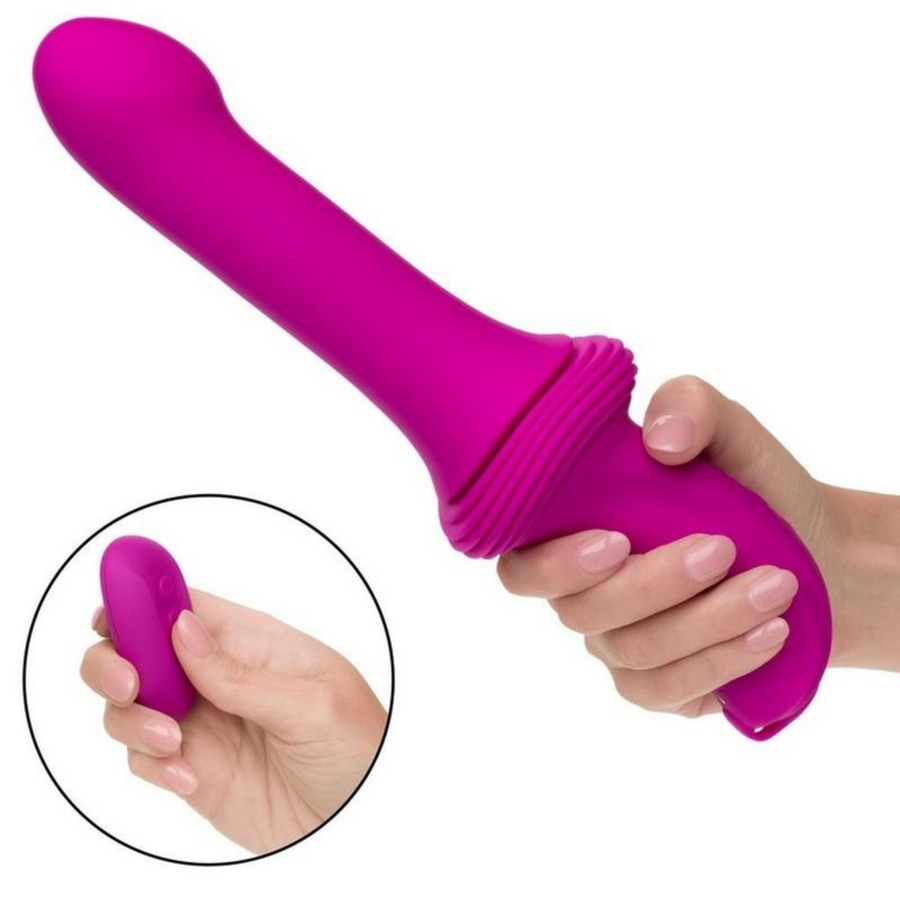 pink thrusting vibrator in hand with pink remote