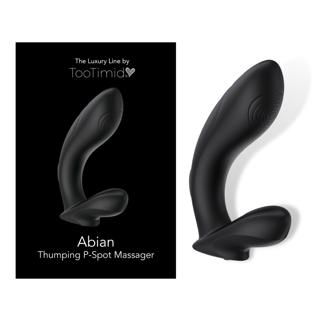 black p-spot vibrator laying next to its packaging 