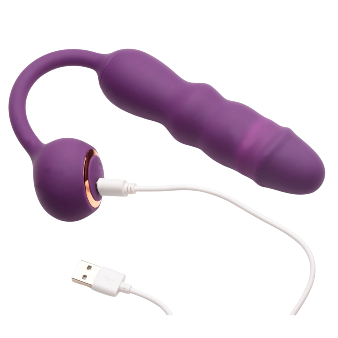 Inmi Thrust Thumper Rechargeable Silicone Vibrator with Remote Control view showing where the charger attaches to the product.