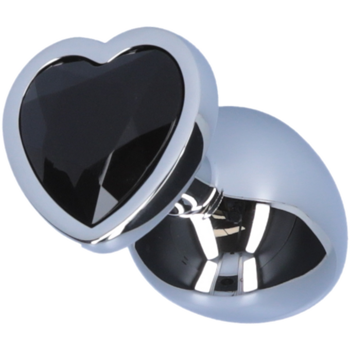 Image of butt plug laying on its side, showing the black heart jewel on the bottom.