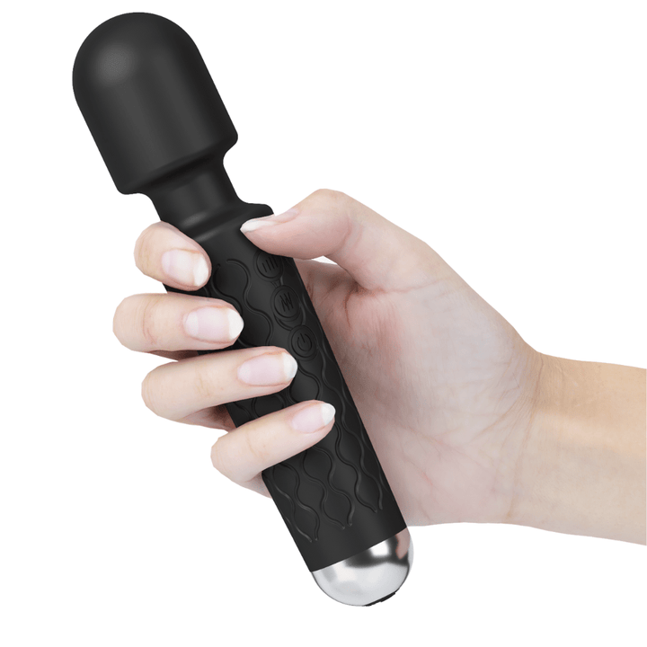Image of hand holding the wand massager.