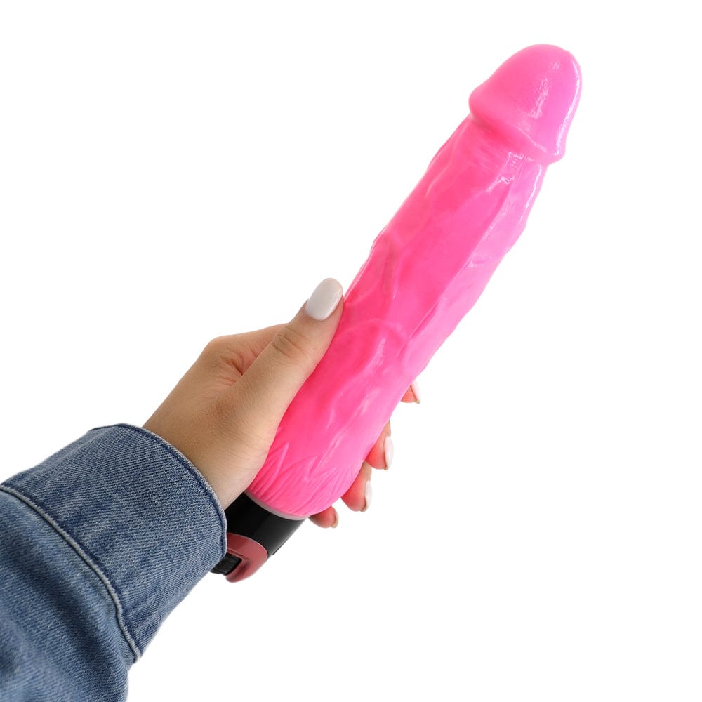 Image displays hand holding the dildo.